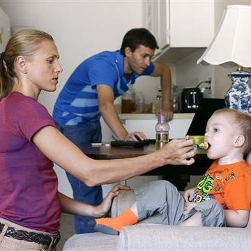 Image: Russian Olympian couple Yuliya and Vitaly Stepanovs with their son after an interview with Reuters