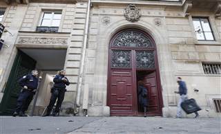 Image: Police stand guard outside the entrance where Kim Kardashian West was staying