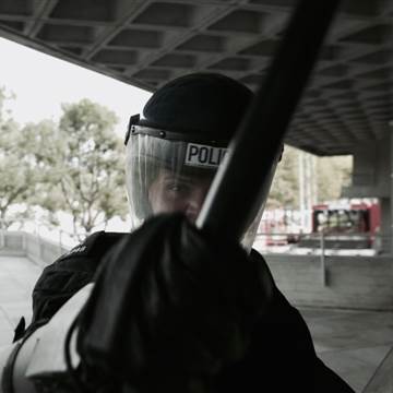 Image: A still from the movie "RIOT", which individual users stand in front of to watch as their emotions are read