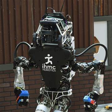 The robot named 'Running Man' developed by Team IHMC Robotics walks an obstacle course during the finals of the DARPA Robotics Challenge at the Fairplex complex in Pomona, Calif. on June 5, 2015. (Photo by Mark Ralston/AFP/Getty)