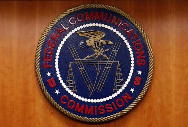 The Federal Communications Commission (FCC) logo is seen before the FCC Net Neutrality hearing in Washington