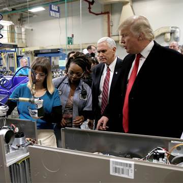 Image: U.S. President-elect Donald Trump tours a Carrier factory with Greg Hayes, CEO of United Technologies (L) in Indianapolis