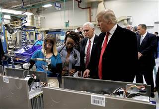 Image: U.S. President-elect Donald Trump tours a Carrier factory with Greg Hayes, CEO of United Technologies (L) in Indianapolis