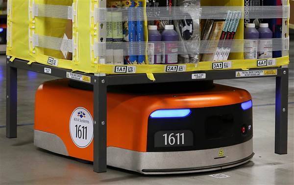 Image:  A Kiva robot moves a rack of merchandise at an Amazon fulfillment center