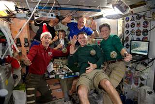 Image: All six members of the Expedition 50 crew aboard the International Space Station celebrated the holidays together with a festive meal