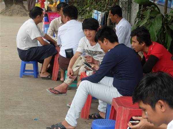 Image: Men at a roadside tea stall in Yangon