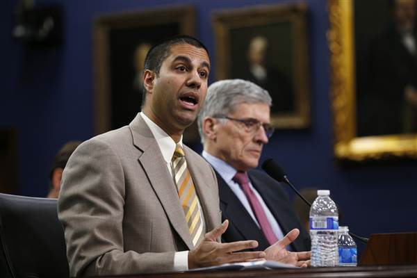 Image: FCC Commissioner Ajit Pai and FCC Chairman Tom Wheeler testify at a House Appropriations Financial Services and General Government Subcommittee hearing on Capitol Hill in Washington on March 24, 2015.
