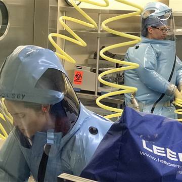 Image: Scientists at the University of Texas Medical Branch work in a specialized, high-security biological containment facility to develop therapies for dangerous pathogens like Marburg and Ravn viruses