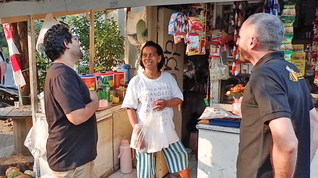 BukuKas co-founders Krishnan Menon (left) and Lorenzo Peracchione (right) with a BukuKas user