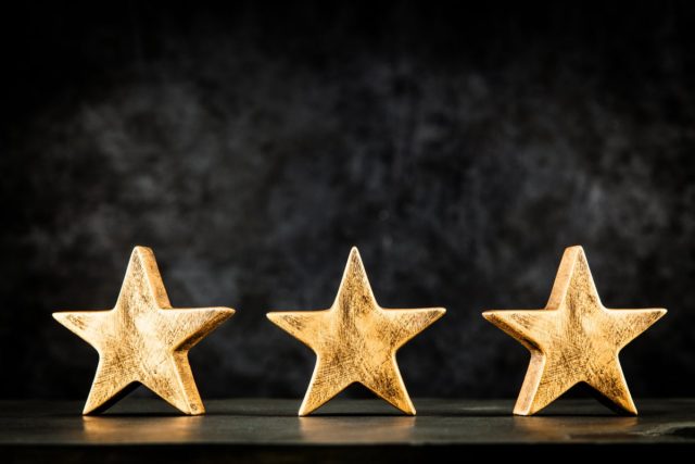 3 stars, award, dark background