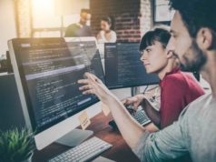Developers embracing API-first improvement, survey says Developing programming and coding technologies. Website design. Programmer working in a software develop company office.