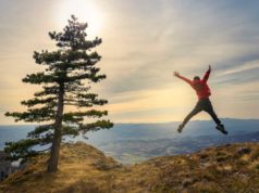 True multithreading in Python ultimately! Person jumping for joy on a mountaintop. Freedom, expansion, triumph.