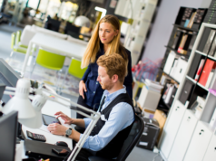 69% of Job Seekers Say Enterprise AI Fails to Boost Workplac… Two office workers in an office setting.