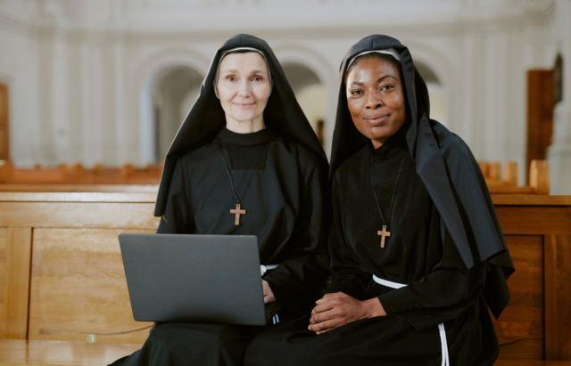 Two nuns with laptop.