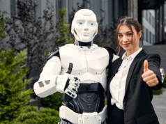 Elon Musk’s Latest 7-Inch Tesla Bot Action Figure Sells Out … A humanoid robot and a woman making a thumbs up sign.