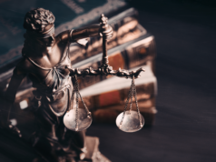 84-Page OpenAI Lawsuit Exposes How AI Training Allegedly Vio… Statue of the Lady Justice with lawbooks on the background.