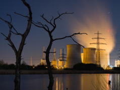 AI Dangers: Scientists Warn A Fukushima-Level AI Disaster Is… A nuclear power station during the night.