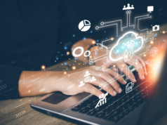 Red Hat’s Hybrid Cloud AI Strategies Expand Through AWS Coll… Businesswoman using laptop to access cloud computing system with various cloud-related images on virtual screen.