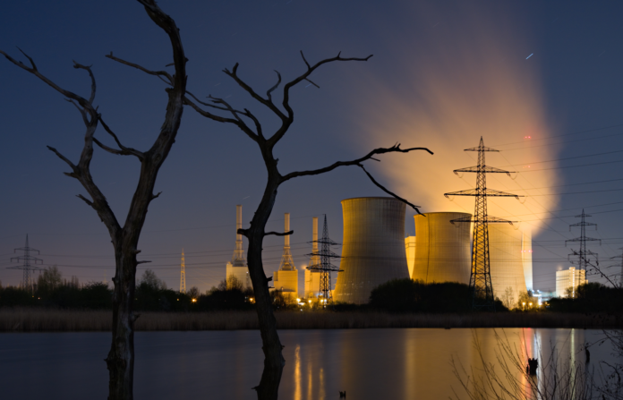 A nuclear power station during the night.