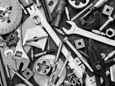 Microsoft .NET Community Toolkit backs partial… shutterstock 175644863 scattered clutter of nuts bolts wrenches tools in black and white