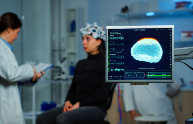 Neurologist scanning a patients brain.