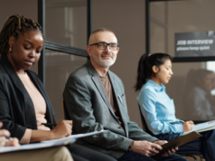 AI Expected to Replace More than 200,000 Wall Street Jobs Potential employees lined up for a job interview.