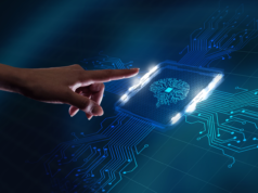 Odoo Outranks ChatGPT Among the Most Captivating AI Producti… Hand interacting with a virtual microchip with a digitized brain icon.