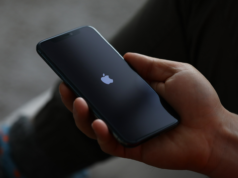 Google Removes Gemini From Its Main App for iOS Devices Male hand hold Apple iPhone Pro.