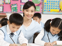 China’s AI Education Starts Early, But There Are Restriction… Teacher assisting students in class.