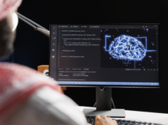 AI vs. Developer Jobs: Anthropic Predicts Replacement, IBM P… Engineer developing AI on a workstation.