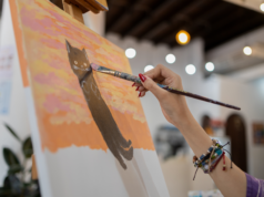 AI Art Copyright Denied: What Does a Star Trek Cat Poem Have… Watercolor artist is painting art on paper.