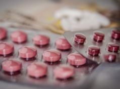 Can AI Cut Cancer Drug Delivery Time In Half? Close up shot of medicine or pills.