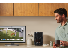 Why is Alexa+ Missing Some Highly Anticipated New Features? … Man watching a video while having coffee.
