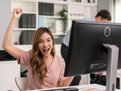Get Paid to Share Your Data to Build AI, Thanks to This MIT … Female employee raising hands happy and laugh for receiving good news.