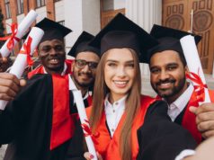 Oldest Business School in US Launches New AI Program Stock photo of graduates.