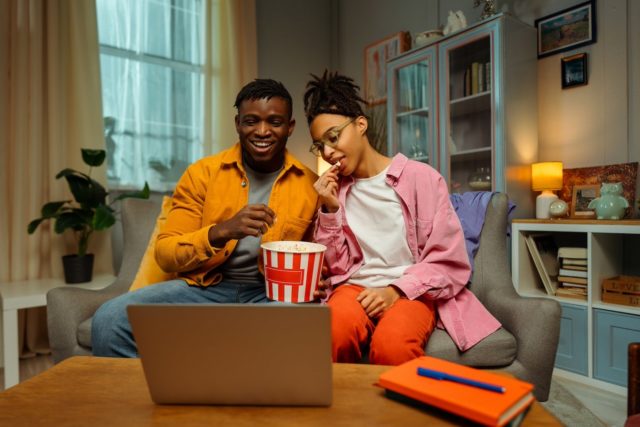 1744917111_Not-Sure-What-to-Watch-Next-Just-Ask-Netflixs-New.jpg Stock photo of two young adults watching a movie.