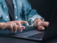Django 5.2 launch touts automated mannequin importing Person at laptop keyboard shown updating software.