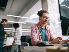 Gleam 1.10 improves compiler, JavaScript codegen Programmer working and developing software in office