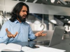 AI Writing Assistants Guilty of ‘Cultural Stereotyping and L… An employee getting frustrated in front of his laptop.