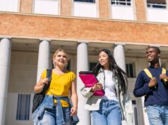 Classrooms Divided: The Unsettled Role of AI in Higher Educa… Stock photo of college students.