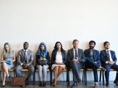 The AI Question Leaders Should Be Asking About Hiring & Busi… Stock photo of job candidates waiting to be interviewed.