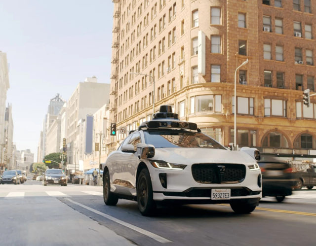 1749677387_Waymo-Robotaxis-Torched-in-LA-Protests-‘Something-Out-of-a.jpg A Waymo self-driving vehicle.