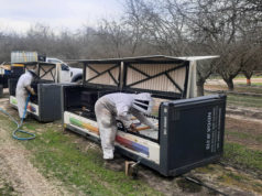 How Beehives Using AI & Robotics Are Saving Bees Beekeepers using a machine to work on their bees.