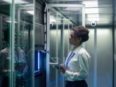 Dumping mainframes for cloud could be a expensive mistake data-center-woman-mainframe-african-american-black