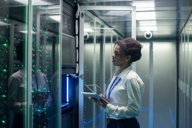 Dumping-mainframes-for-cloud-can-be-a-costly-mistake.jpg data-center-woman-mainframe-african-american-black