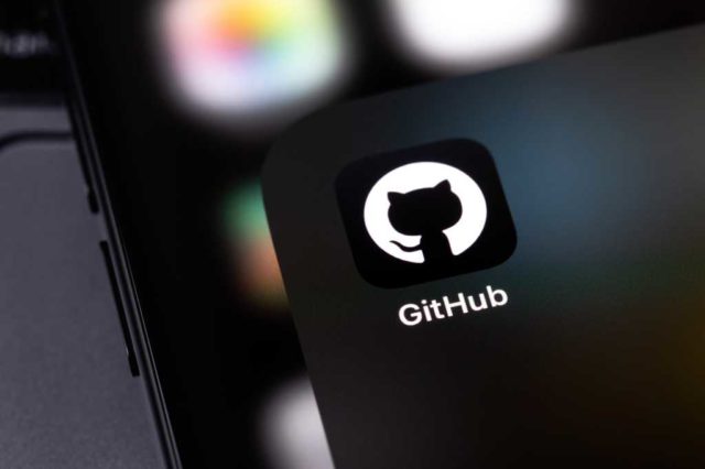 GitHub-hit-by-a-sophisticated-malware-campaign-as.jpg GitHub mobile icon app on a screen smartphone and notebook closeup. GitHub is the largest web service for hosting and developing IT projects. Batumi, Georgia - November 4, 2023