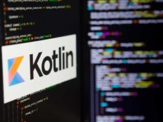 Kotlin cozies as much as Spring Framework A computer screen shows the Kotlin logo against a backdrop of code.