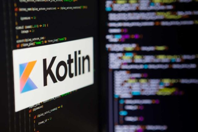 Kotlin-cozies-up-to-Spring-Framework.jpg A computer screen shows the Kotlin logo against a backdrop of code.