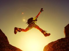 Spring Java creator unveils AI agent framework for the… Leap, jump, risk, adventure. A person leaping between two boulders.