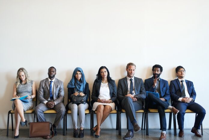 Stock photo of job candidates waiting to be interviewed.
